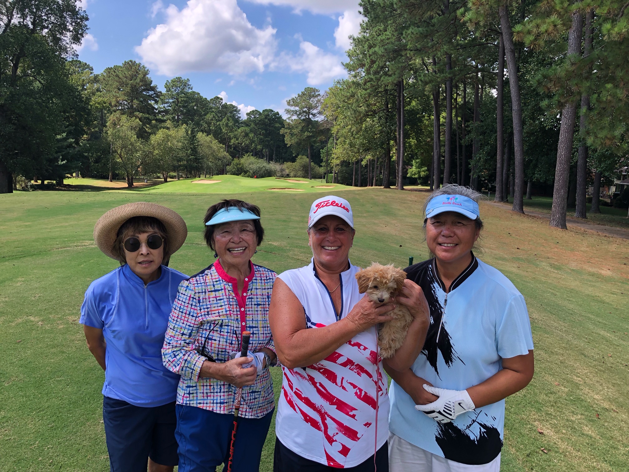 Donna Buxton and others on a golf course fairway