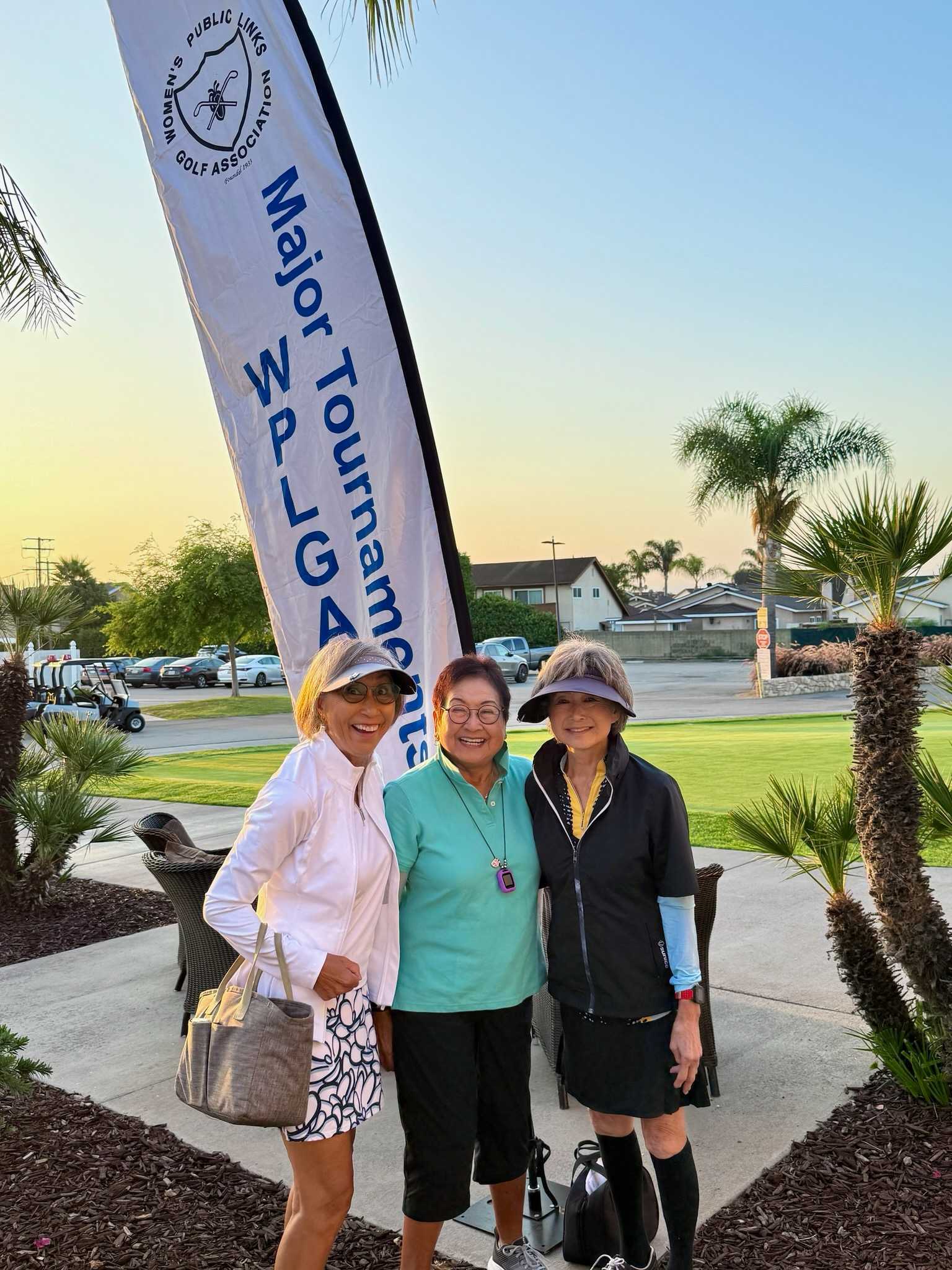 Sandy Suzuki testimonial image. Three women standing in front of WPLGA Major Tournament banner